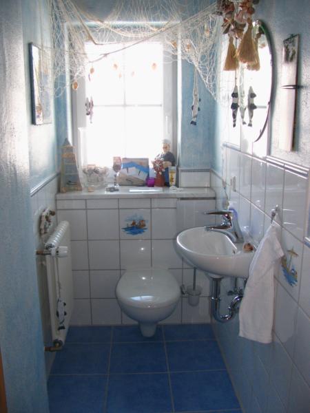 Gäste WC maritim mit einzelnen Motiv Fliesen